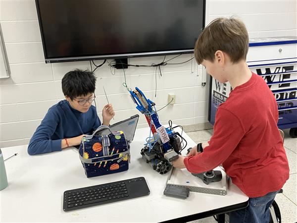 Students working on a robot.